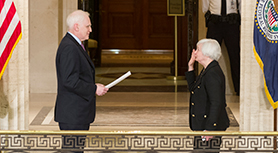 Chair Janet L. Yellen takes the oath of office, administered by Governor Daniel K. Tarullo, at her ceremonial swearing-in. The event took place at the Federal Reserve Board in Washington, D.C., on March 5, 2014.