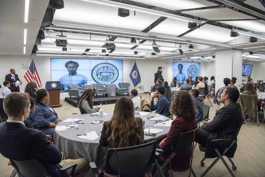 Students listening to Exploring Careers in Economics presentation