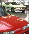 Photograph of cars in showroom